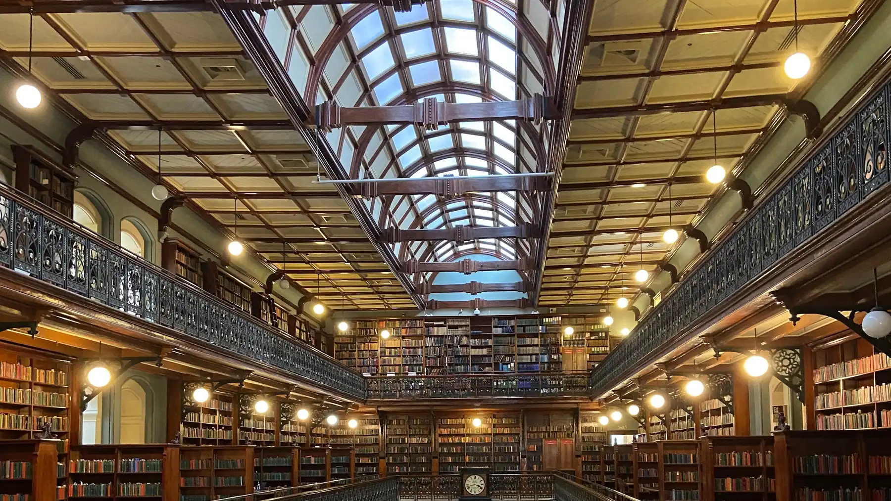 Bookshelves, iron galleries and the glass roof in Adelaide’s Mortlock Chamber