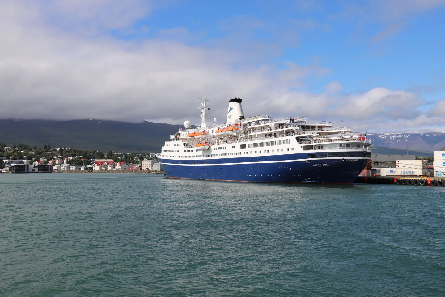 A large cruise ship at Akureyri harbour, distinct from the smaller whale-watching vessels