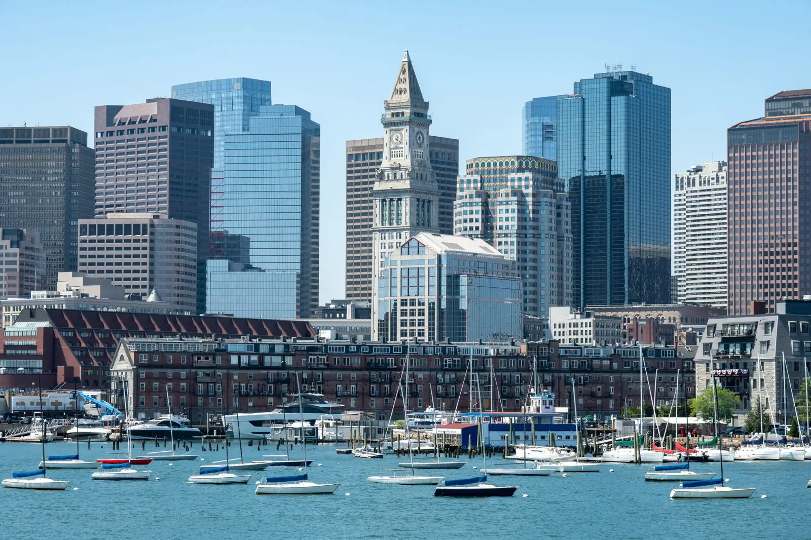 Boston waterfront wharves and boats with the recognisable Custom House clock tower