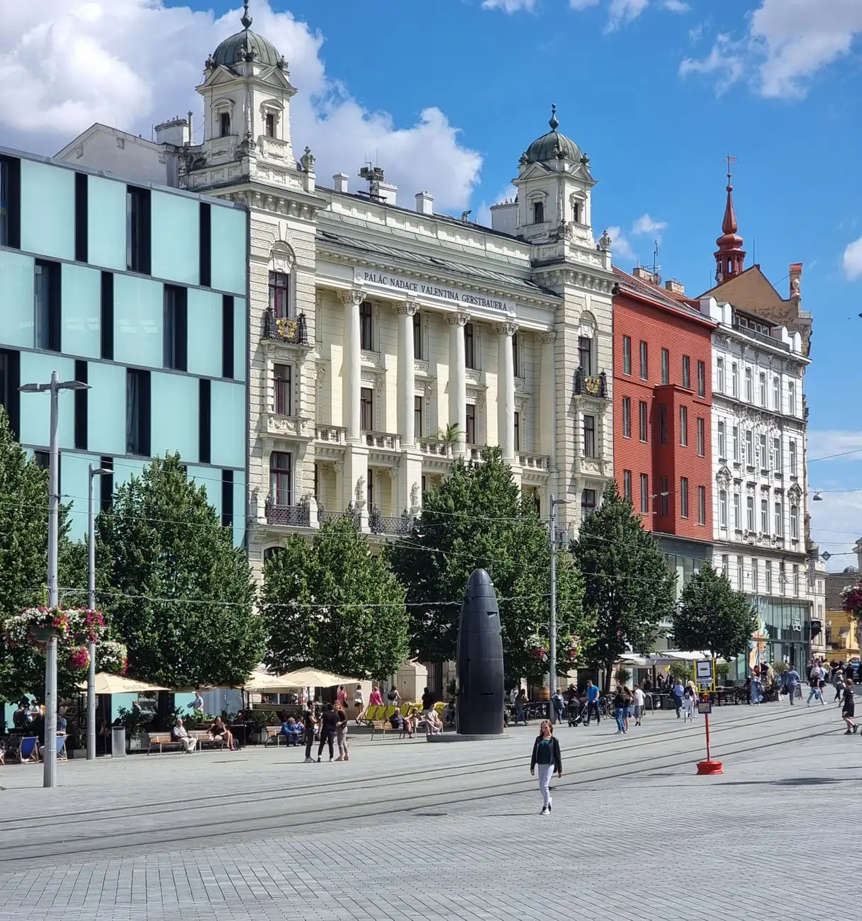 Freedom Square in Brno, with the House of Four Giants, neighbouring façades and the black granite clock