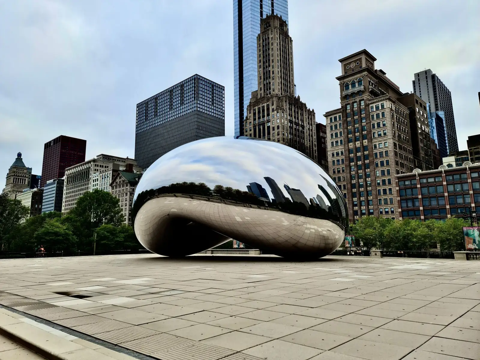Cloud Gate reflecting Chicago’s skyline in Millennium Park