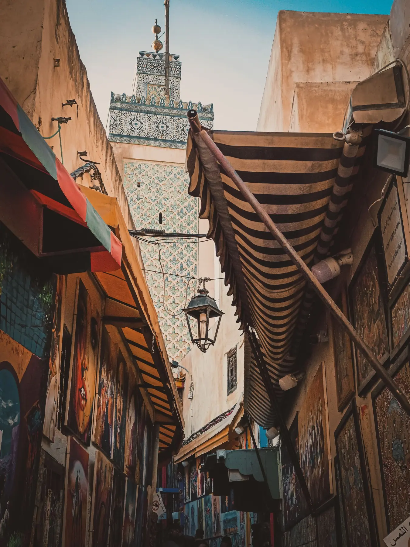 Captivating alley in Fes, Morocco, showcasing traditional architecture and vibrant art.