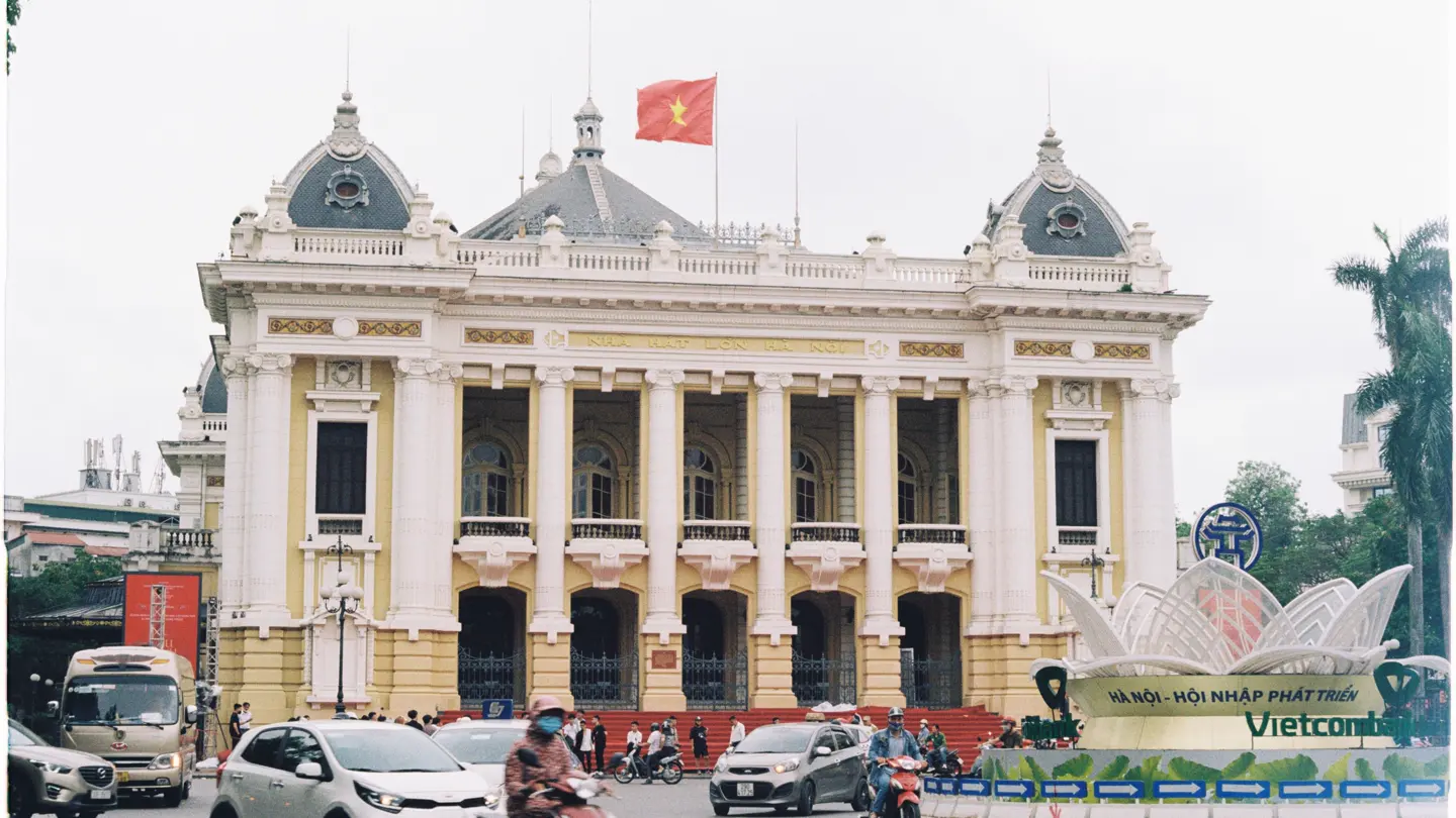 Traffic passes Hanoi Opera House in the French Quarter.