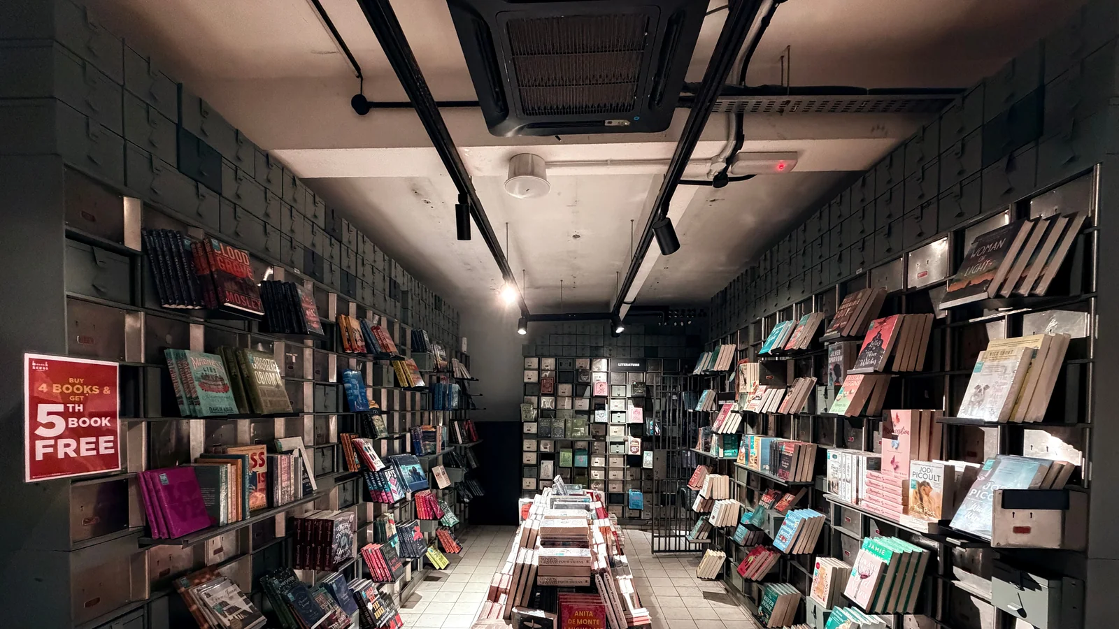 Rows of books displayed among the former bank’s metal fittings at BookXcess Kong Heng in Ipoh.