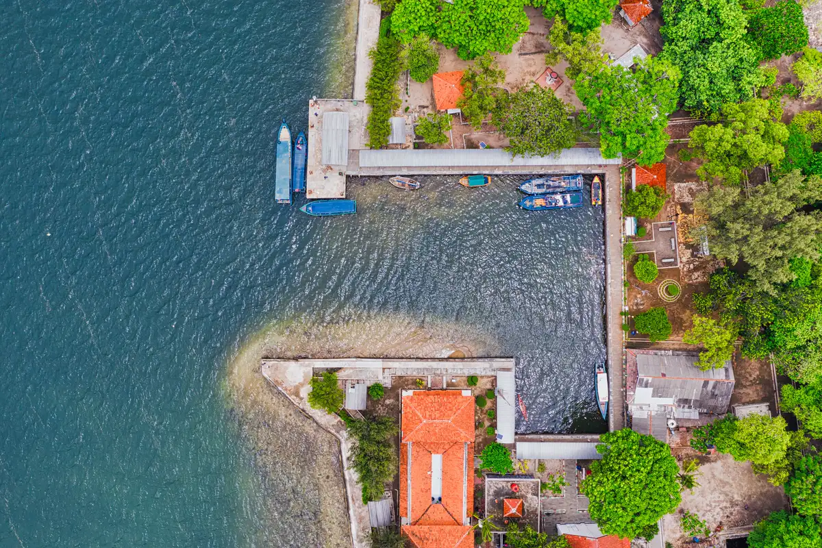 Aerial view of a small island jetty and boats in Kepulauan Seribu