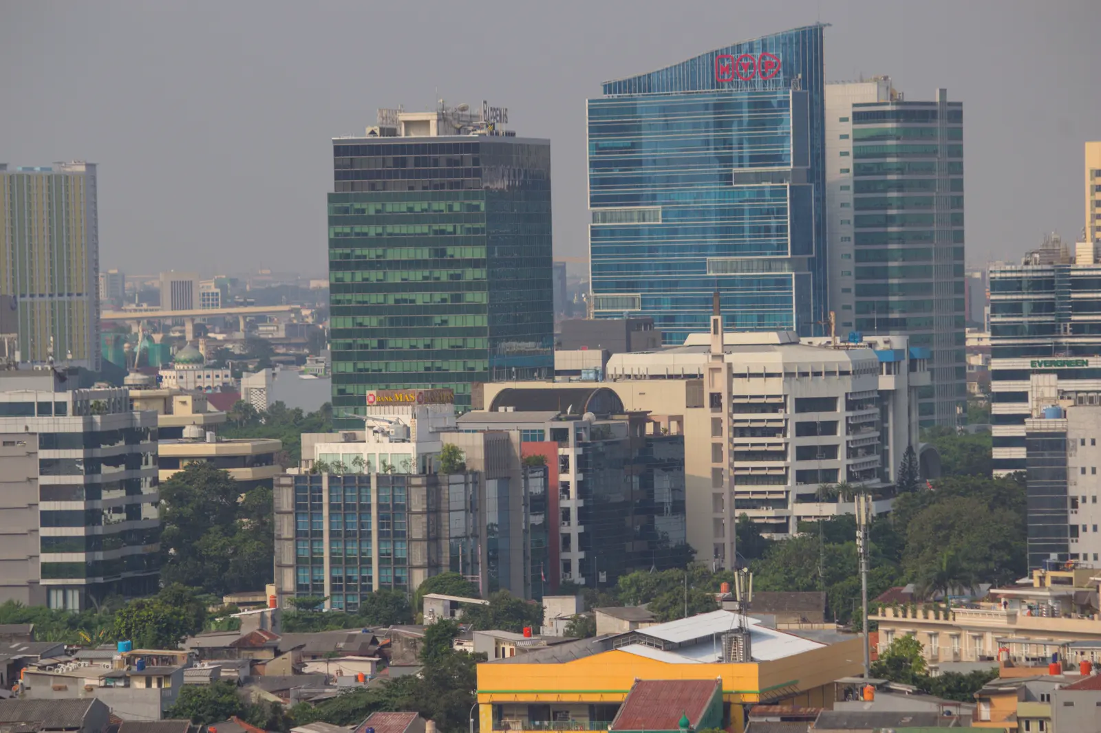 Jakarta’s modern skyline seen above the dense city