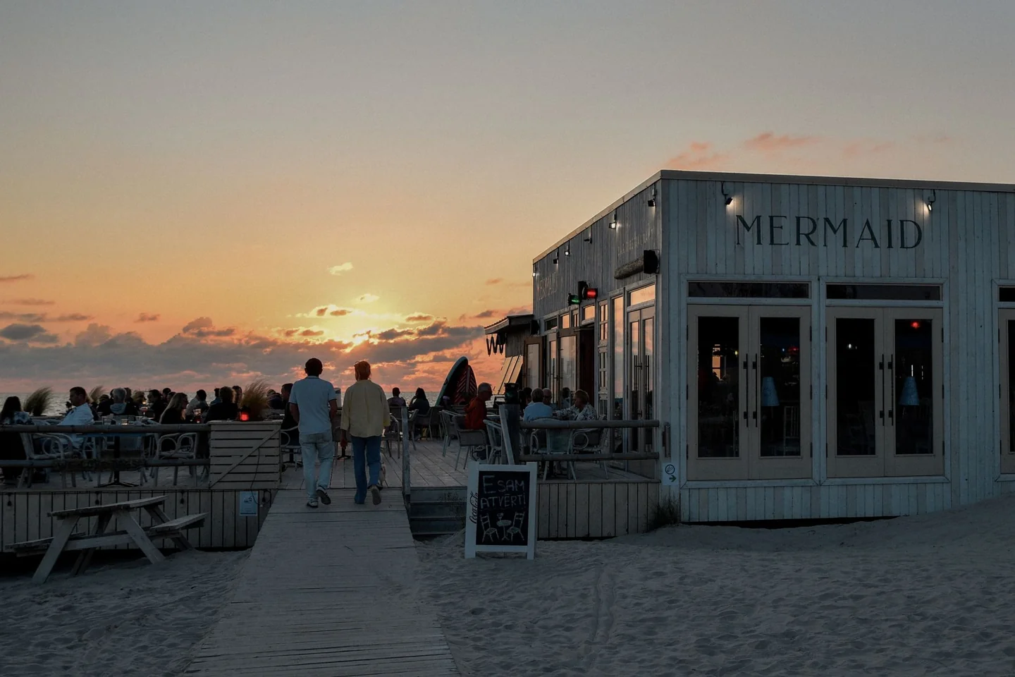 Mermaid Café and its beachfront terrace at sunset in Liepāja