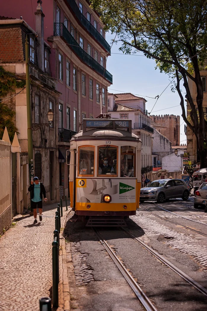 A vintage tram on a sunny Lisbon street