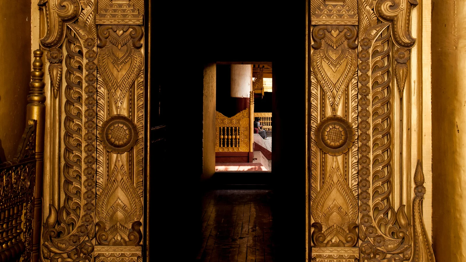 A gilded carved doorway and a further opening inside Mandalay Palace, photographed before the current access review.