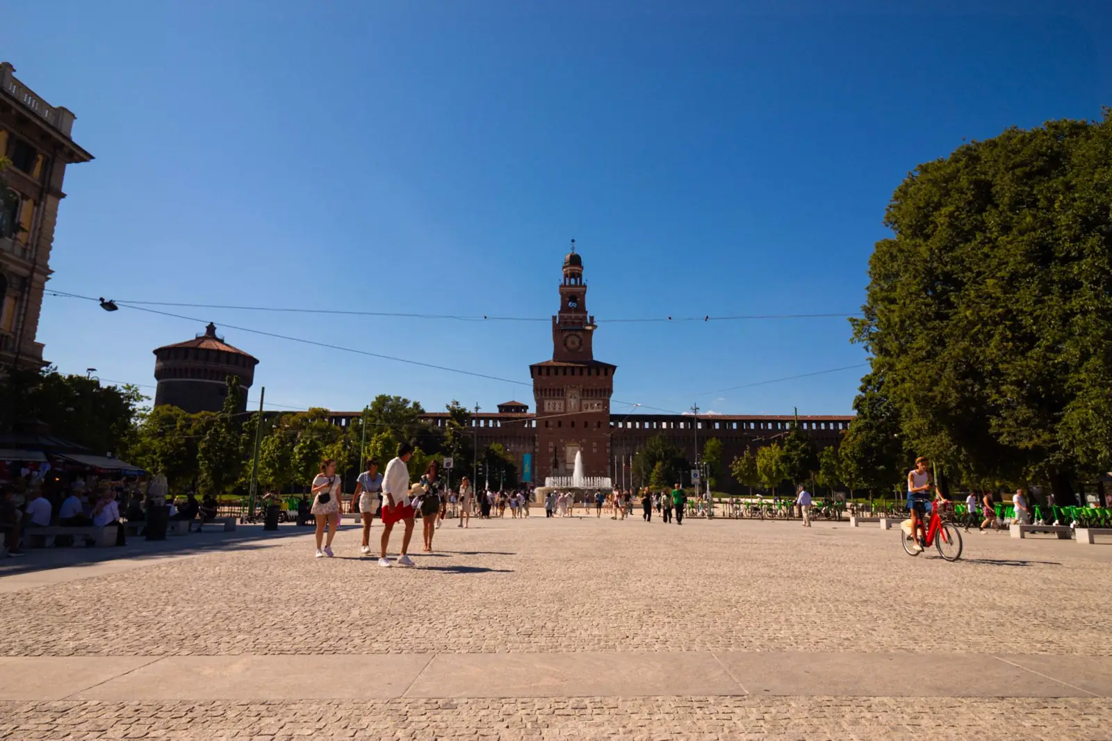 Sforza Castle tower beyond its approach square in Milan