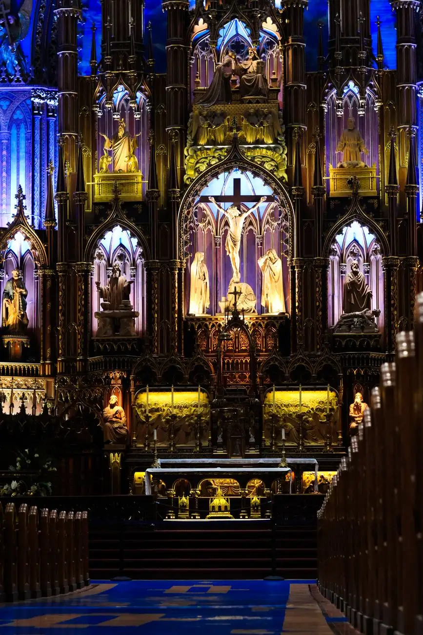 Illuminated carved altar and blue interior inside Notre-Dame Basilica in Montréal