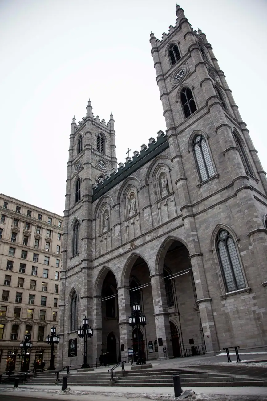Notre-Dame Basilica’s twin towers and Gothic facade facing Place d’Armes in Montréal