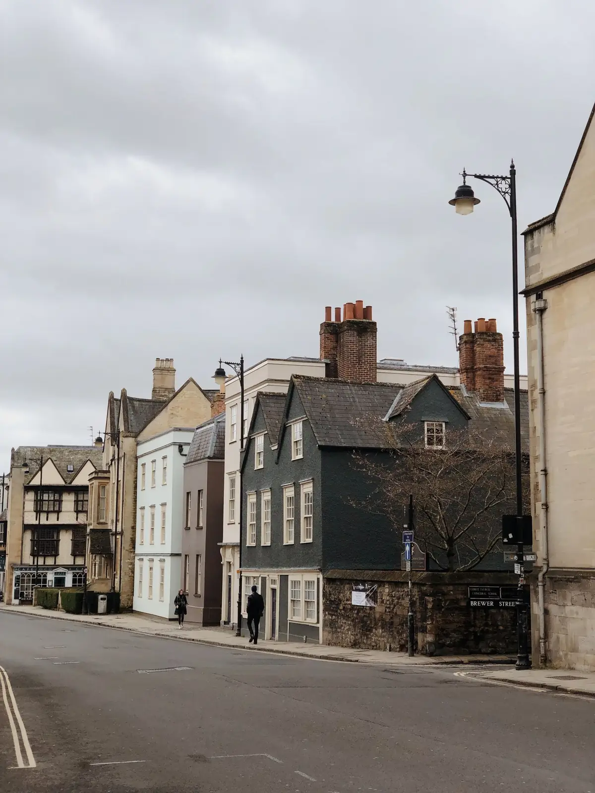 Historic Oxford street under a cloudy sky