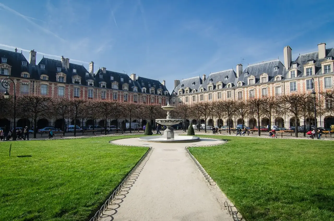 Place des Vosges with its fountain and brick façades