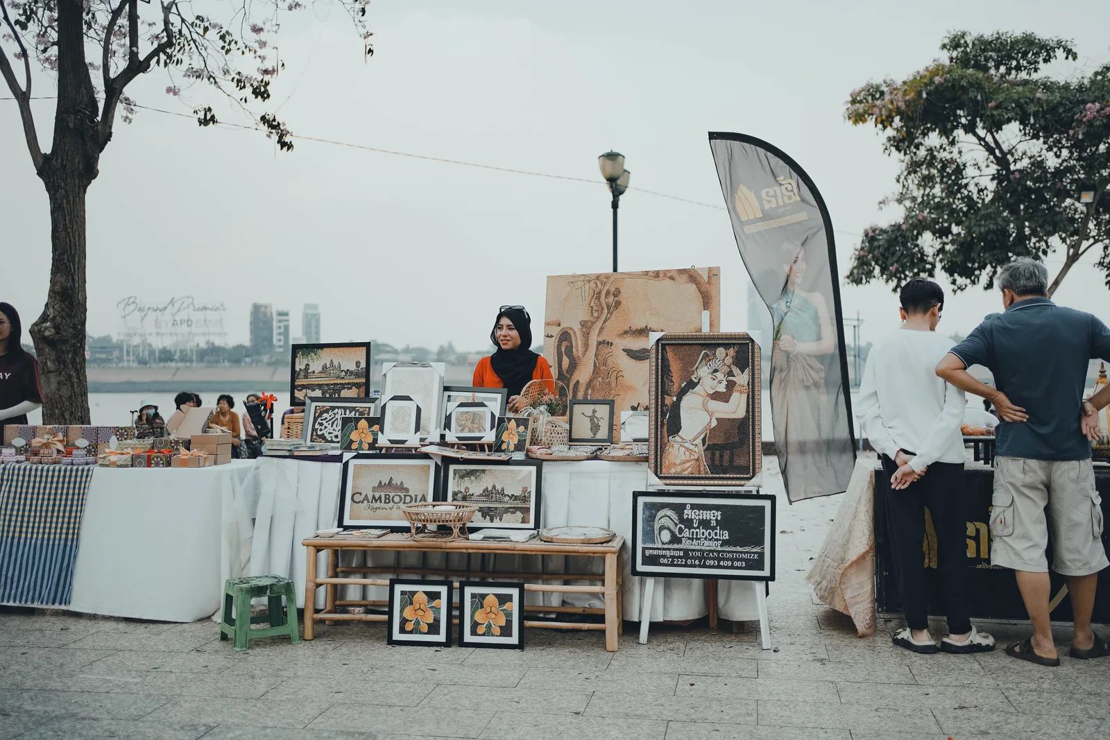 A riverside market stall displaying Cambodian art and crafts in Phnom Penh.