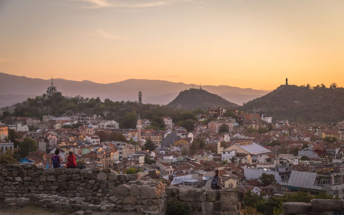 Plovdiv’s rooftops and hills at sunset beyond the remains on Nebet Tepe