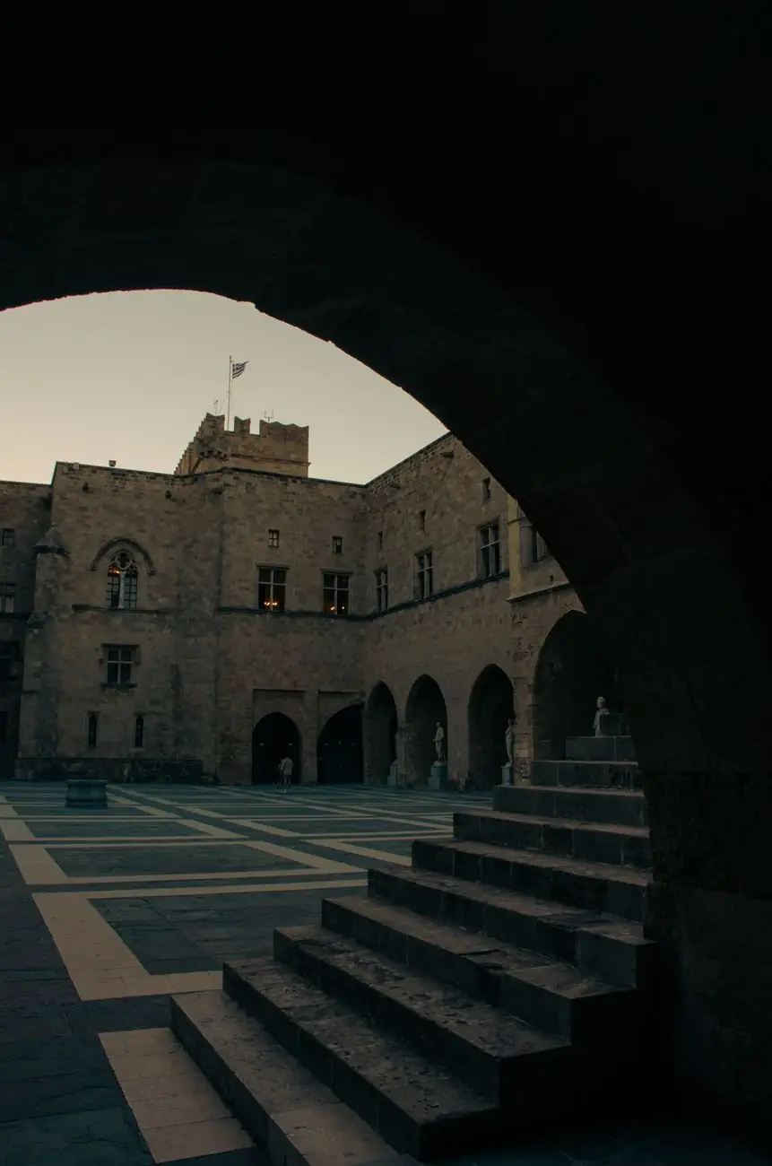 Palace of the Grand Master courtyard seen through a stone arch