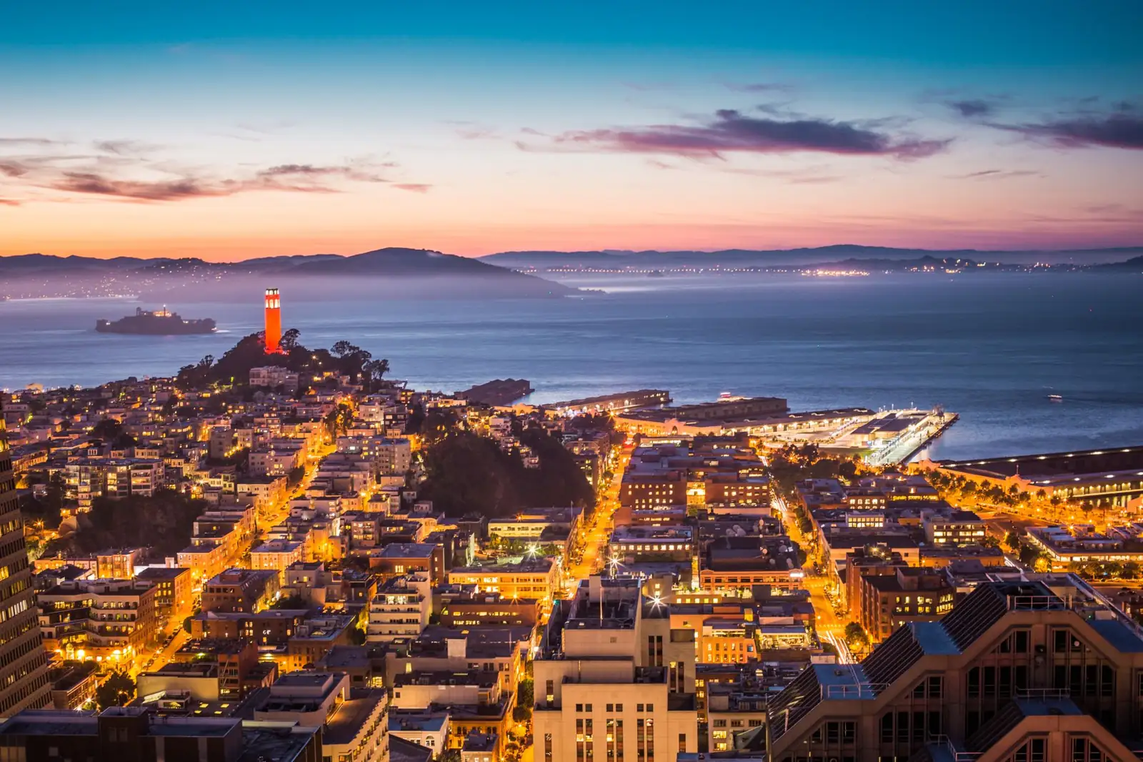 Coit Tower on Telegraph Hill, the San Francisco waterfront and Alcatraz across the bay