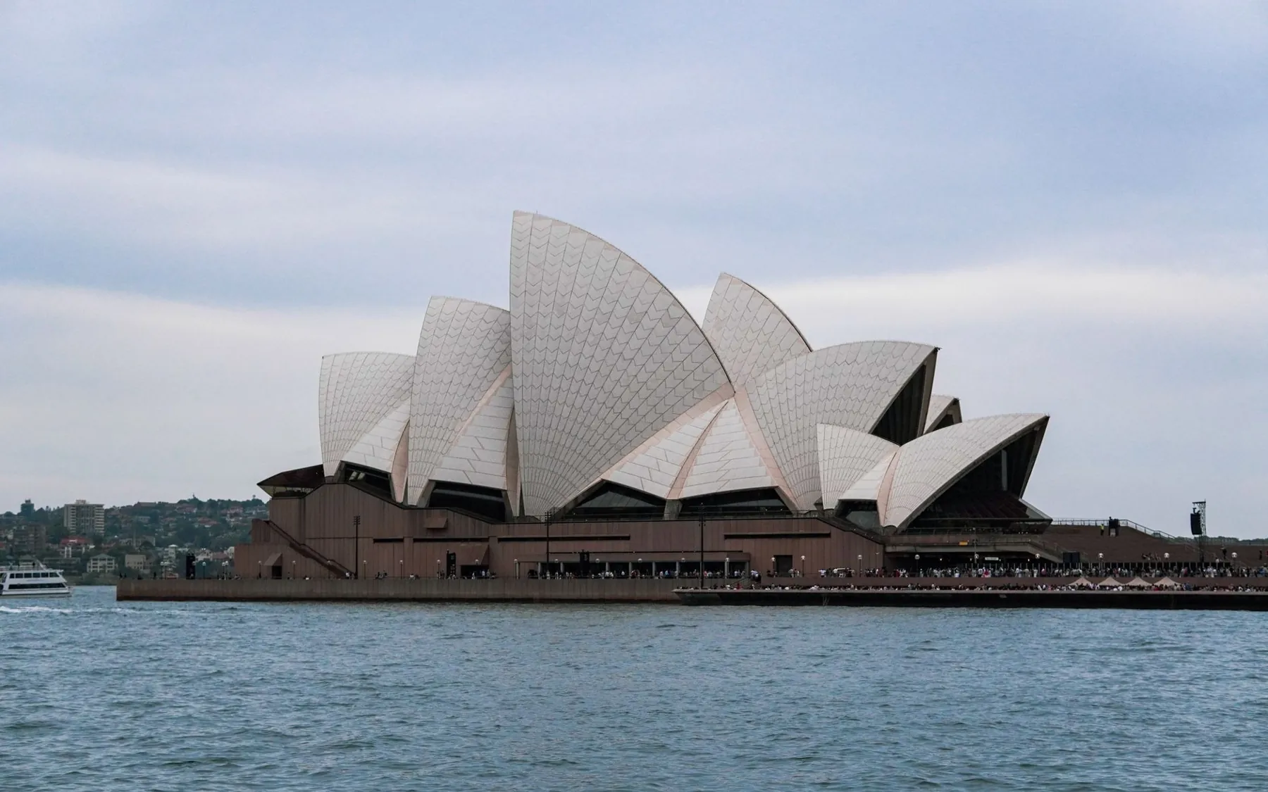 The tiled sails of Sydney Opera House seen across the water
