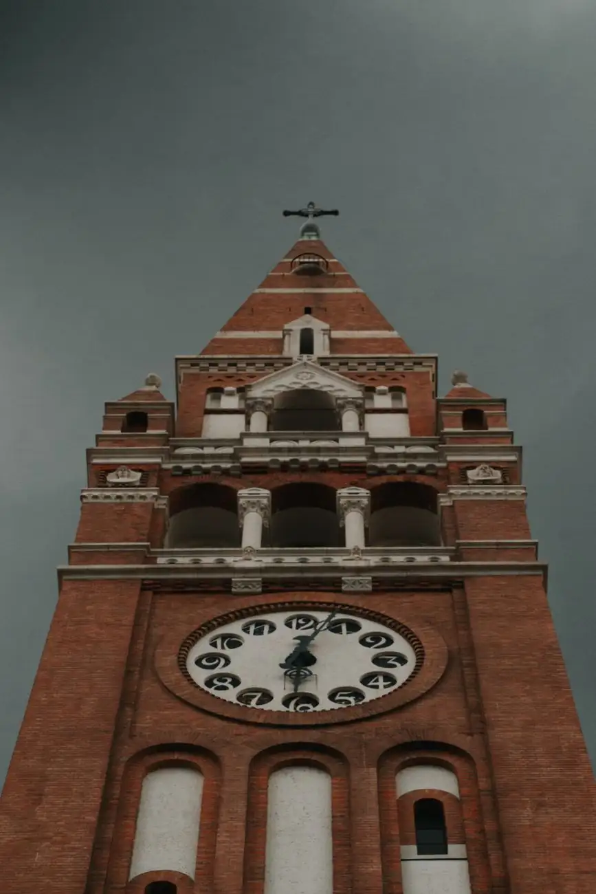 Clock faces and brick detailing on one of Szeged Cathedral’s twin towers