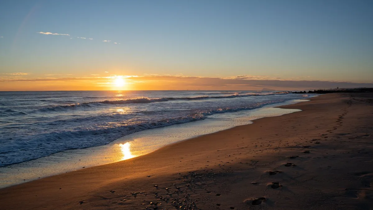 Sunrise reflected on the Valencia beachfront