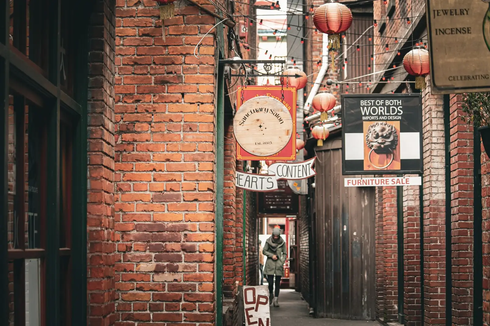 Brick walls, red lanterns and shop signs along Fan Tan Alley in Victoria