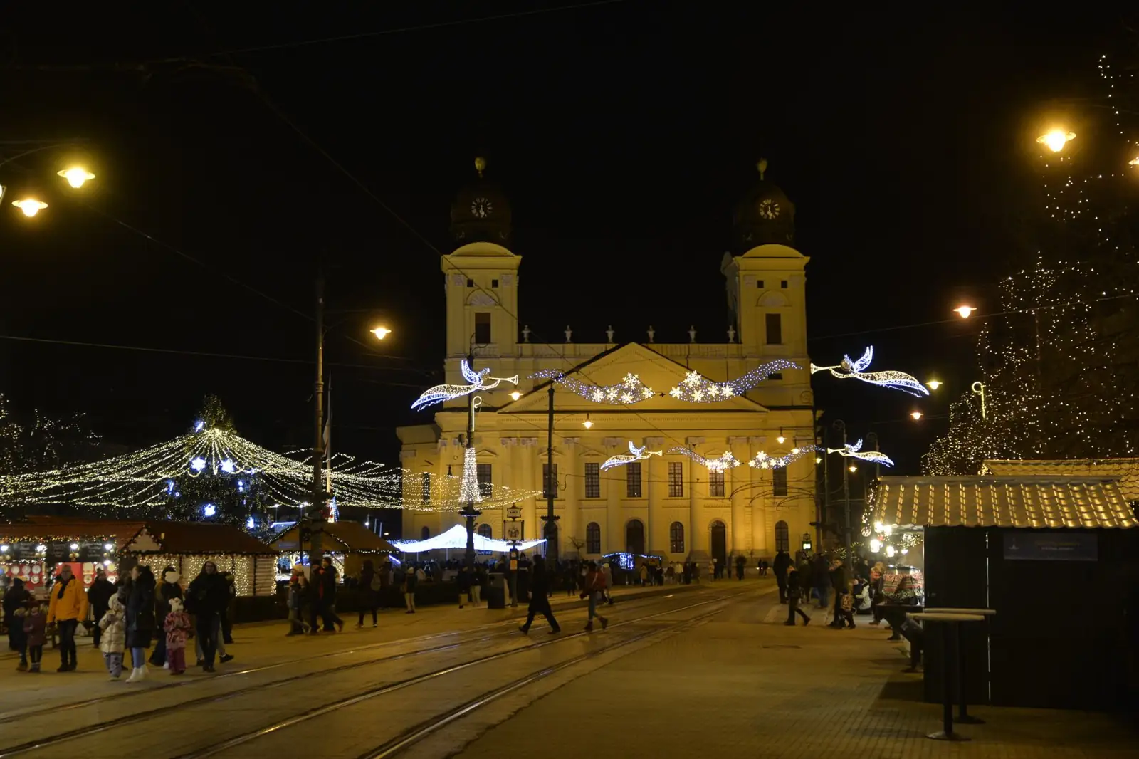 Debrecen’s twin-towered Reformed Great Church across Kossuth Square with winter festive lights