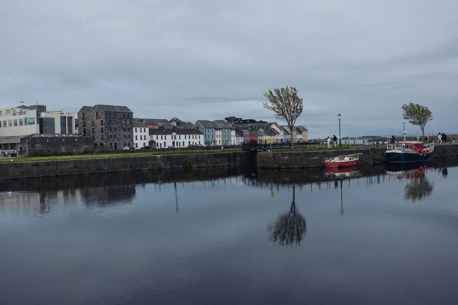 Colourful waterfront buildings and boats in Galway