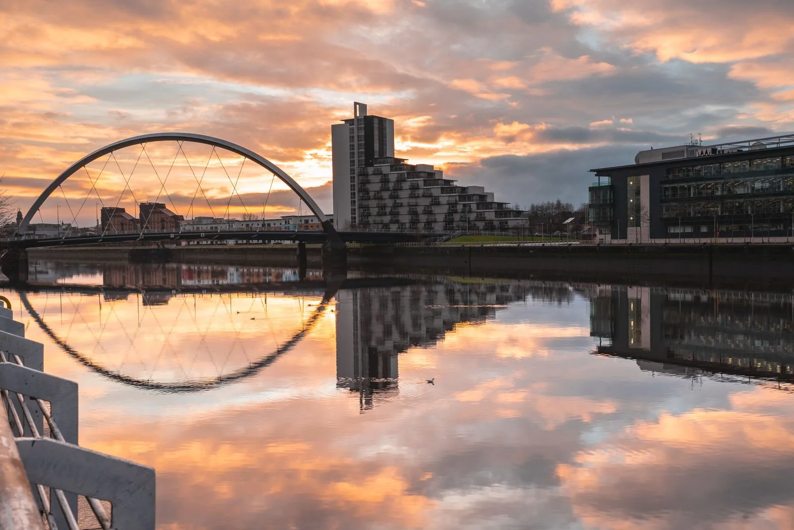The Clyde Arc and modern Glasgow buildings reflected in the River Clyde