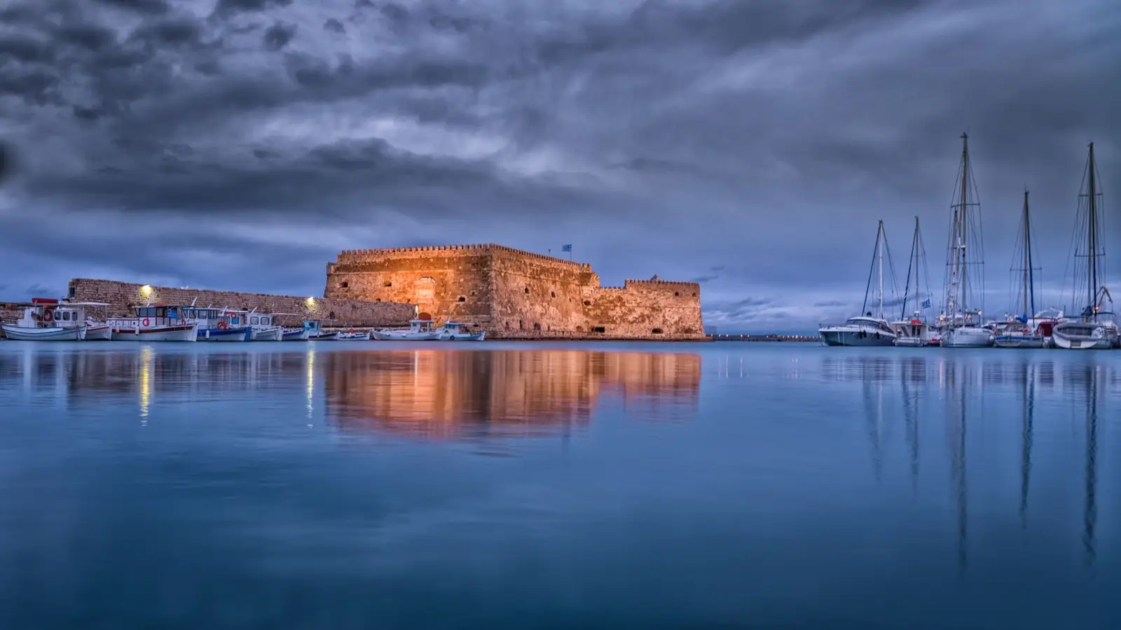 Koules Fortress reflected in Heraklion’s Venetian harbour at dusk