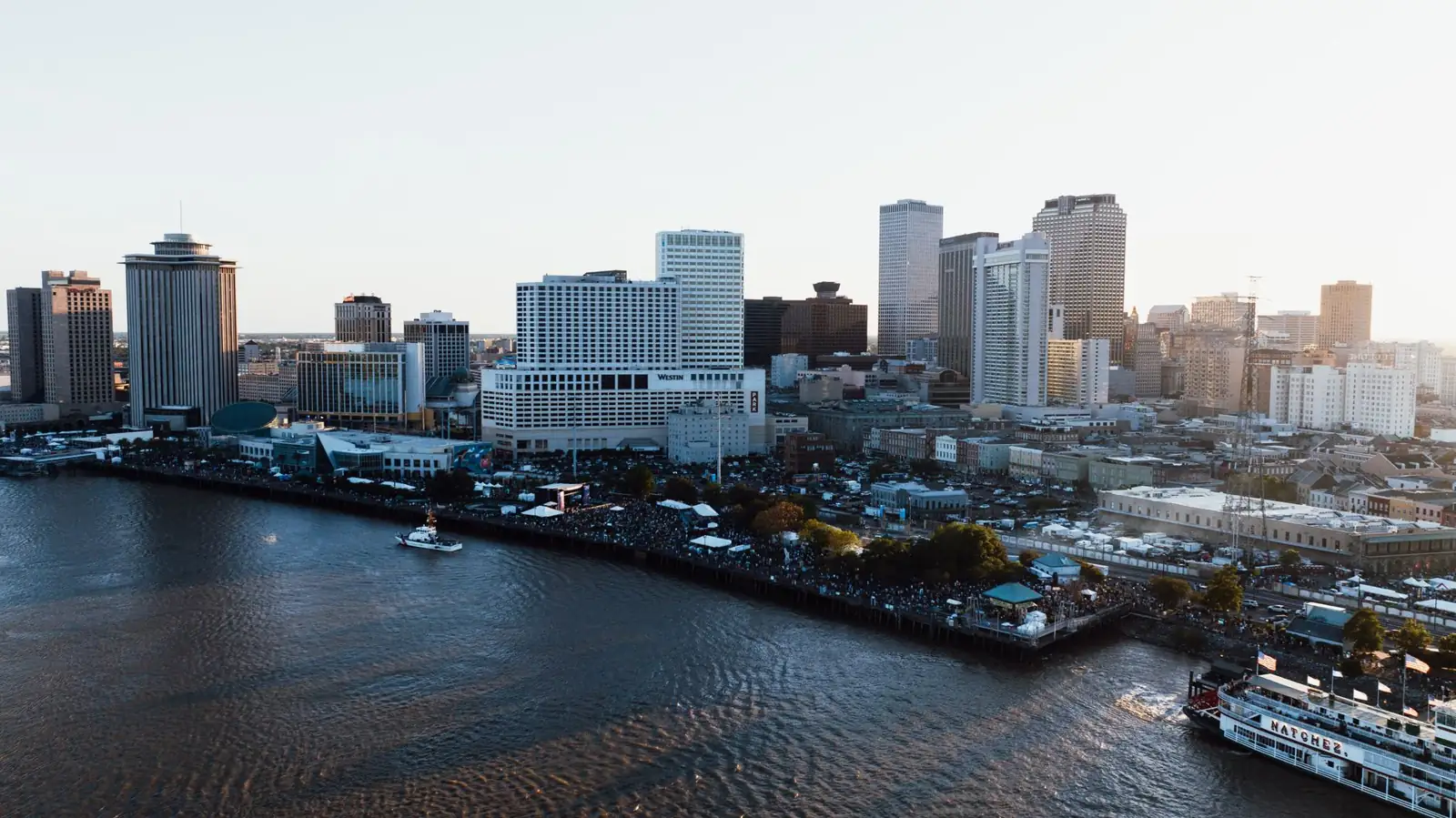 New Orleans Mississippi riverfront with the NATCHEZ and recognisable downtown hotels and towers
