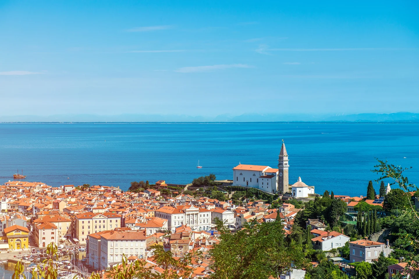 Piran’s red-roofed peninsula, St George’s church and the Adriatic Sea