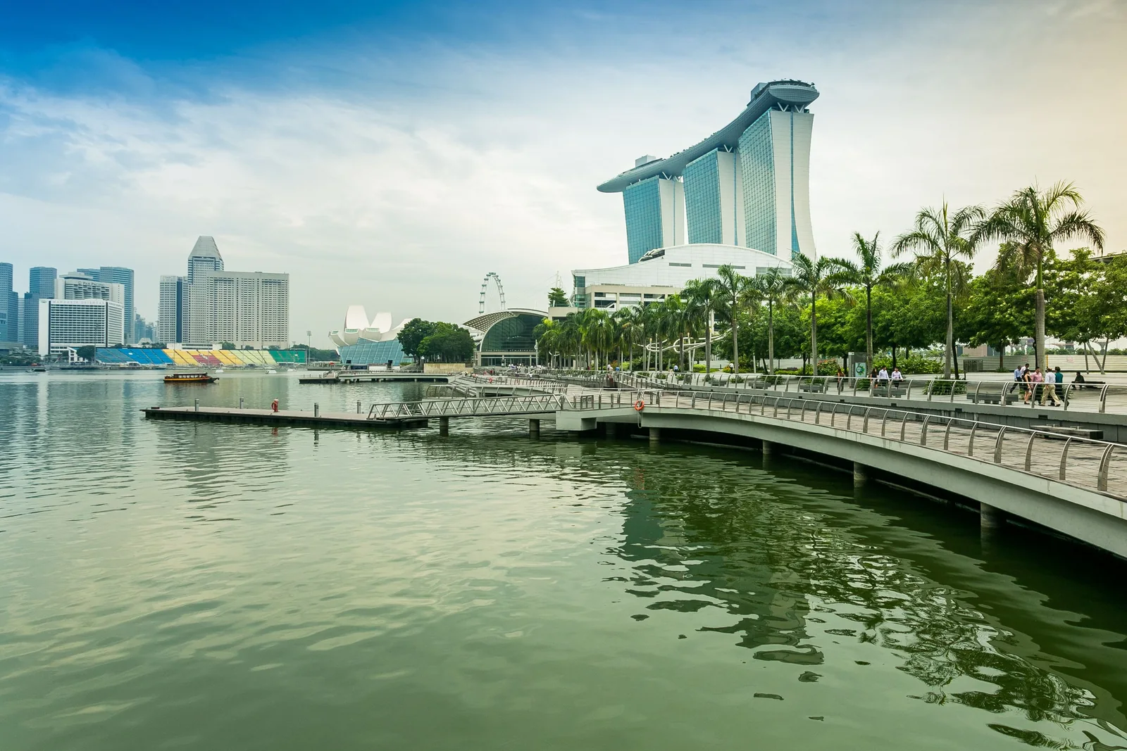 Marina Bay Sands rises over Singapore’s waterfront, with the ArtScience Museum and promenade across the bay.