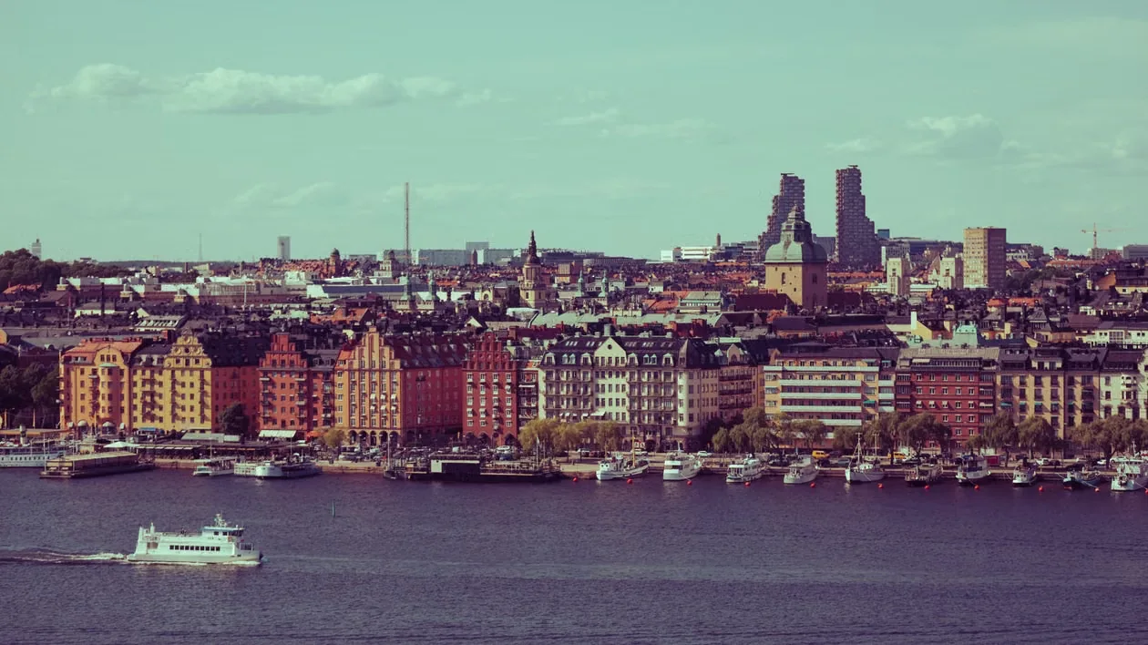 Stockholm waterfront with colourful buildings, boats and church towers