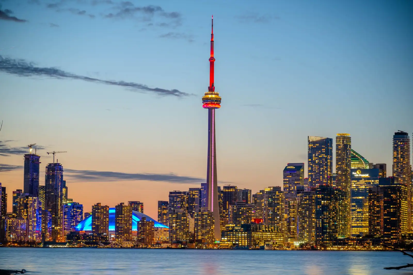 Toronto waterfront skyline at sunset with the recognisable CN Tower