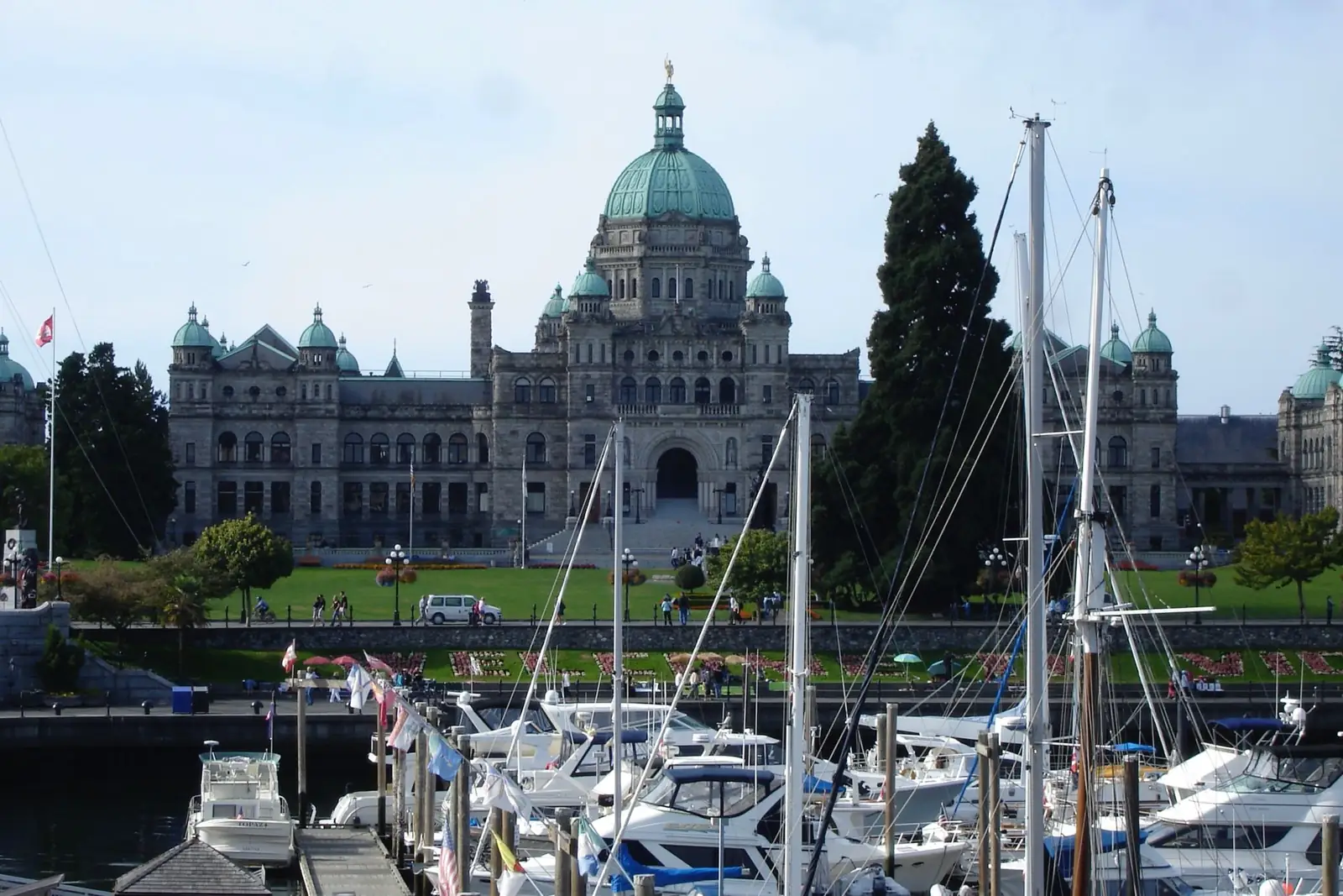 British Columbia Parliament Buildings above sailboats in Victoria’s Inner Harbour